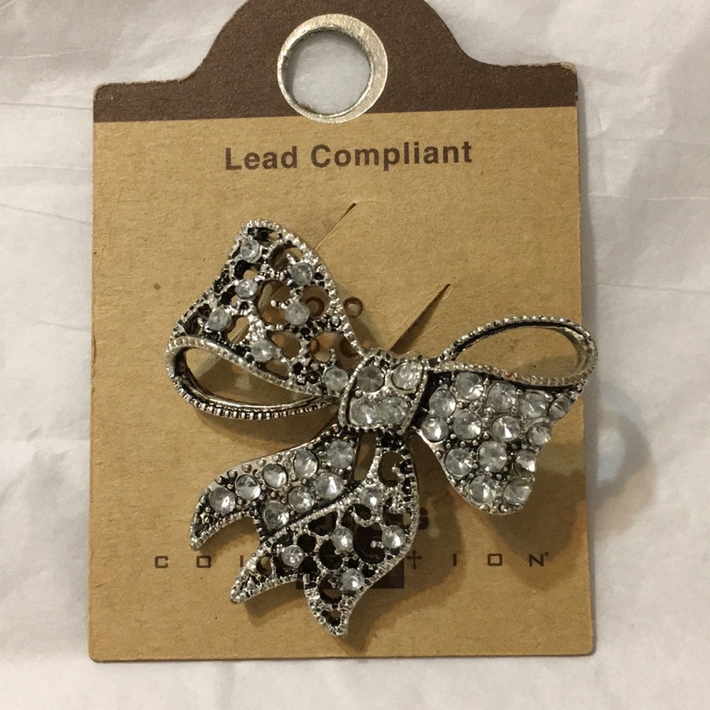 Bow shaped brooch with rhinestone accents